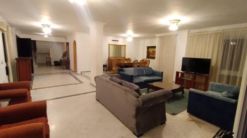 a living room with two couches and a tv at Vacation villa in Sharm El Sheikh on the beach in Sharm El Sheikh