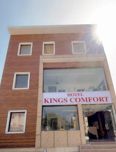 a building with a sign that reads hotel kings comfort at Hotel Kings Comfort in Tājganj