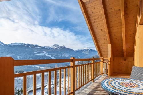 a balcony with a view of the mountains at nawu apartments & Restaurant in Hermagor