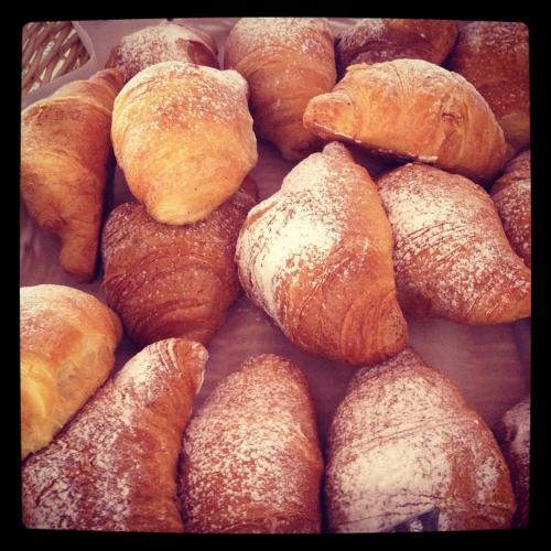 a pile of croissants sitting on top of a table at Hotel Atlantic in Gatteo a Mare