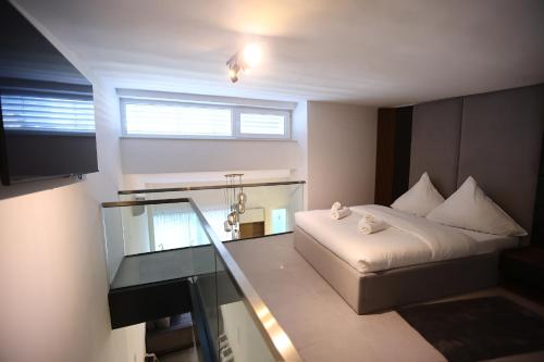 Ένα ή περισσότερα κρεβάτια σε δωμάτιο στο JAM Apartments