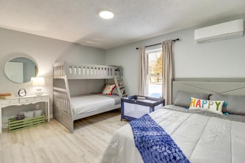 a childs bedroom with a bunk bed and a ladder at 5 Mi to Lake Naomi Home with Hot Tub and Fire Pit in Long Pond