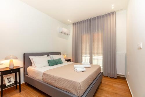 Posteľ alebo postele v izbe v ubytovaní Apartment near City Center