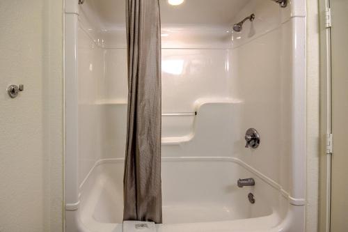 a shower in a bathroom with a white tub at Motel 6 King Of Prussia PA in King of Prussia