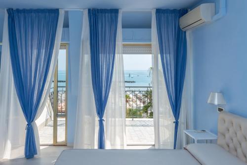 Ένα ή περισσότερα κρεβάτια σε δωμάτιο στο Hotel Dino