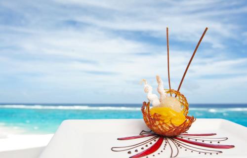 a dessert on a table at the beach at The Crane Resort in Saint Philip