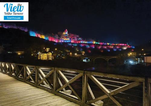 a view of a city at night with lights at The View Veliko Tarnovo Townhouse in Veliko Tŭrnovo