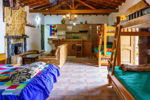 a bedroom with a bunk bed and a living room at CIUDADELA EL ARTESANO in Carolina del Principe