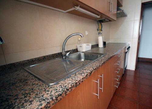 a kitchen with a sink and a counter top at Urban Beach I in Portimão