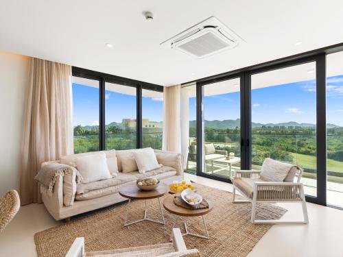 a living room with a couch and a table at Fourteen at Mullet Bay in Cupecoy