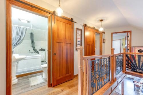 a bathroom with a tub and a toilet and a sink at Cozy Clear Lake Home - Walk to Town and Boat Dock! in Clear Lake
