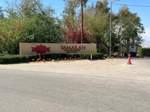 a sign for a park with a sign that says samurai at Spacious apartments with Sea view at Samarah Resort in Sowayma