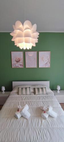Postel nebo postele na pokoji v ubytování L'ORCHIDHEA APARTMENT