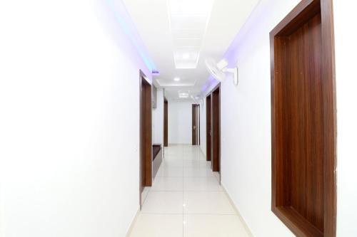 a corridor of an office building with a hallway at OYO Hotel Galaxy in Bathinda