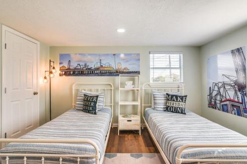 a bedroom with two beds in a room at Hot Tub and Yard Jimmy Buffet-Themed Galveston Home in Galveston