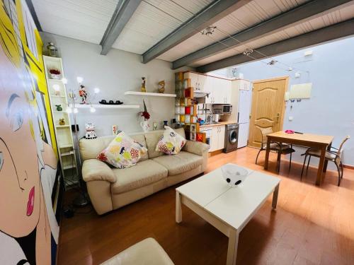 a living room with a couch and a table at Palafox in Madrid