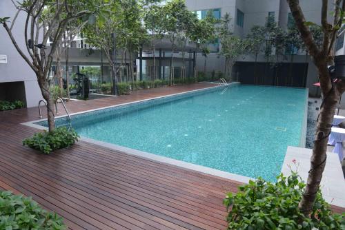 a swimming pool in the middle of a building at Summer Suites Studios in Kuala Lumpur