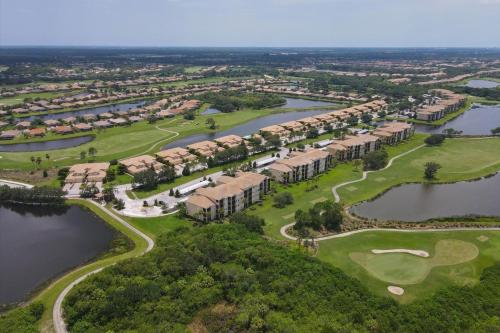 an aerial view of the golf course at the resort on lake detroit at Caddy's Corner! Golf Course Views! Located in River Strand Golf & Country Club in Bradenton