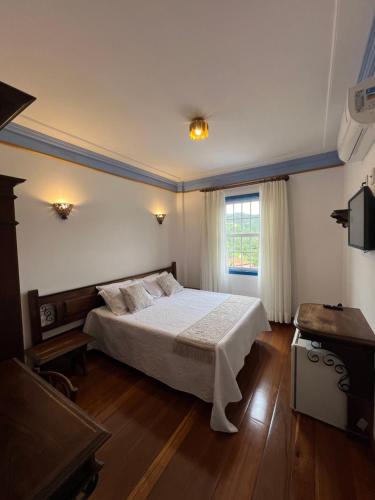 Postel nebo postele na pokoji v ubytování Pousada Sinhá Olímpia