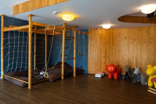 a room with a bunk bed and wooden walls at Seamira House Huahin in Hua Hin