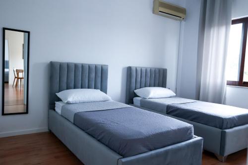 Posteľ alebo postele v izbe v ubytovaní Bianca Vista Tirana