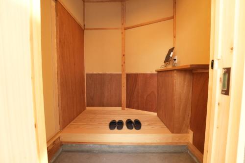 two pairs of shoes are sitting in a room at RIKKA BABA ICHI in Takayama