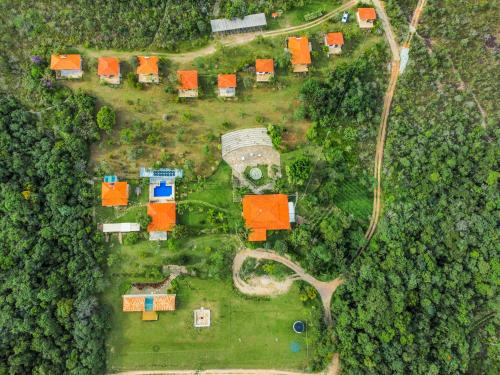an overhead view of a house with orange roofs at Pousada Sete Quedas in Carrancas