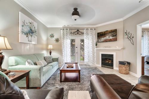 a living room with a couch and a fireplace at Luxury Condo, Sleeps 6, 3.2 Miles to Dollywood in Pigeon Forge