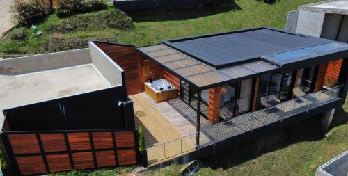 an overhead view of a house with a solar roof at Montecielo Hosting in Guatapé