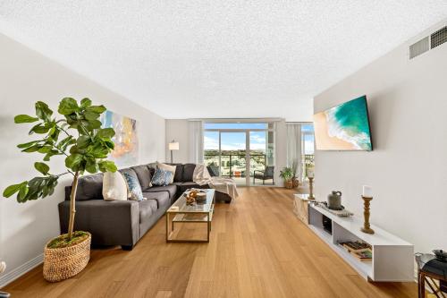a living room with a couch and a table at The tulip Marina Highrise with ocean view in Los Angeles