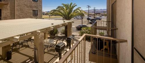 a balcony of a building with a view of a street at 1st Floor Condo in the Desert w/ Pool, Spa & BBQ in Lake Havasu City