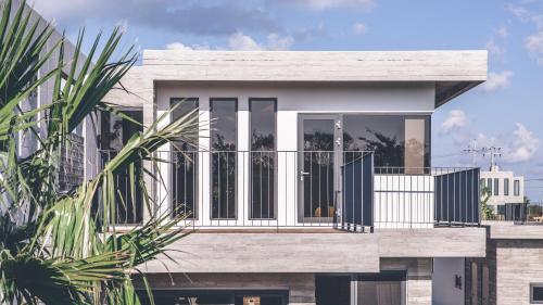a rendering of a house with a balcony at Jeju Private unit for family or group in Jeju