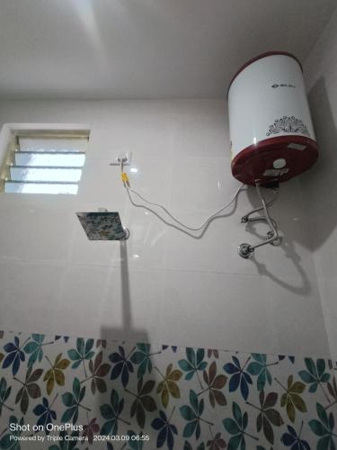 a light on the corner of a room with a wall at Skylight Residency Yercaud in Yercaud