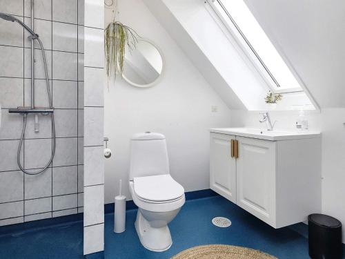 a bathroom with a toilet and a sink and a shower at Holiday home Humble XXXVII in Humble