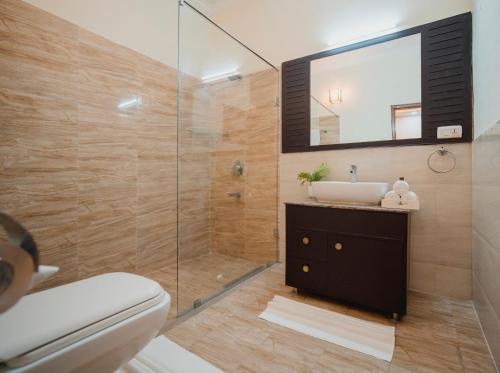 a bathroom with a sink and a shower at Silver Leaf Apartments in Amritsar
