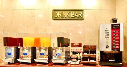 a drink bar with a bunch of different colored drinks at Okayama Universal Hotel Annex in Okayama