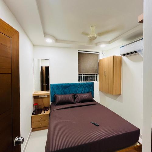 a bedroom with a bed in a room at Sundaram Residency in Chennai