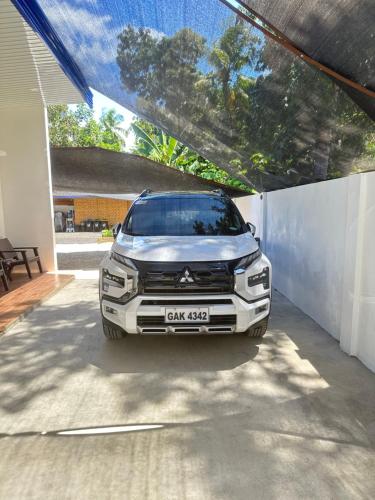 a car parked in a garage next to a fence at Apartment Unit Rental in Dauis Panglao Bohol in Dauis