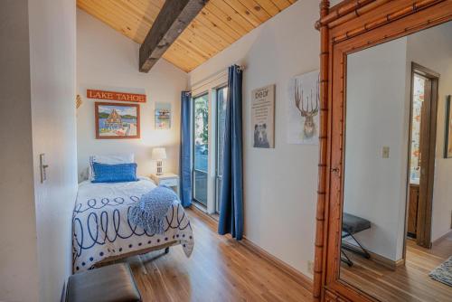 a bedroom with a bed and a wooden floor at O'Hara's Place in Kings Beach