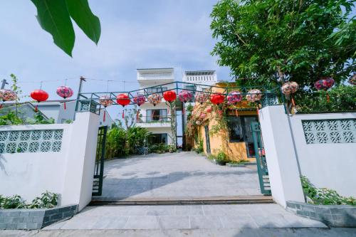 an entrance to a house with red lanterns at BS Jade Home Hội An in Hoi An