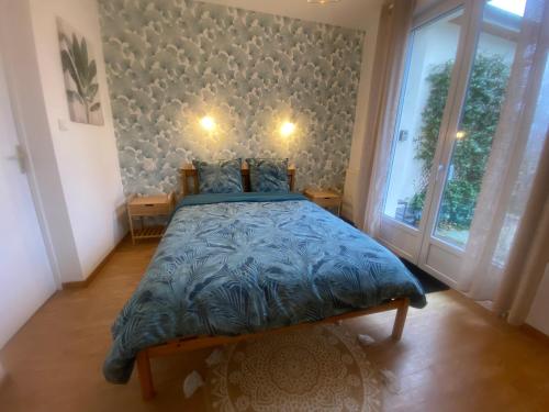 Ένα ή περισσότερα κρεβάτια σε δωμάτιο στο Chambre Sérénité avec SDB privée - 'Les 7 Sources'