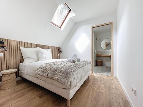 a bedroom with a large bed and a mirror at [PARENTHESE] Le Pic du Midi - 110m² in Bagnères-de-Bigorre