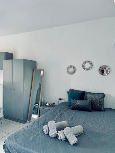 a bedroom with a bed with two towels on it at Nikol studio 2 in Kallithea Halkidikis