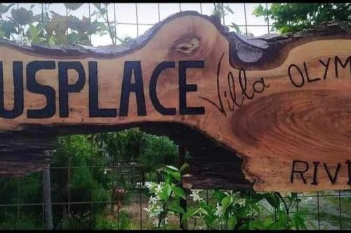 a wooden sign with the words at Zeusplace Olympous Riviera Villa 1 in Litochoro