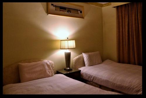 Una cama o camas en una habitación de فندق مشرق كدي