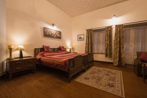 سرير أو أسرّة في غرفة في Clifton Homestay