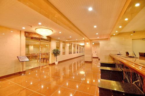 a lobby of a building with a desk in it at Kyoto Universal Hotel Karasuma in Kyoto