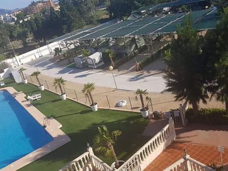 an aerial view of a resort with a swimming pool at Camping Los Llanos in Denia