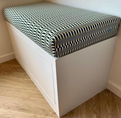 a white bed with a black and white mattress at Studio By Aimee - 20m from the beach & in city centre! in Ostend