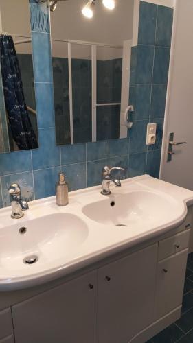 a bathroom with a white sink and a mirror at Manosque: Maison en Provence avec superbe vue in Manosque